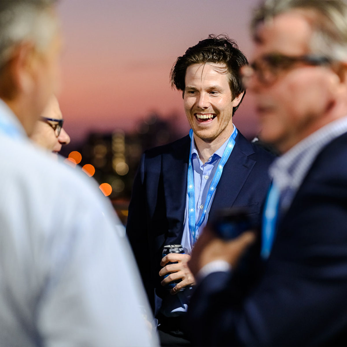 man laughing with group